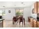 Dining area with patio access and a view of backyard, connected to a modern kitchen with tile floors at 4727 S Watauga Dr, Gilbert, AZ 85297