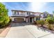 Front exterior of a two-story home with a tile roof, covered entry, and spacious driveway at 4727 S Watauga Dr, Gilbert, AZ 85297