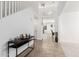 Bright foyer with high ceilings and a decorative chandelier above, with tile flooring at 4727 S Watauga Dr, Gilbert, AZ 85297