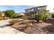 Desert-landscaped front yard with lush plants and stone accents in front of the home at 4727 S Watauga Dr, Gilbert, AZ 85297