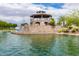 A view of the community gazebo set on a Personal-made lake with a waterfall feature at 4727 S Watauga Dr, Gilbert, AZ 85297
