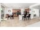 Bright, open kitchen and dining area with tile flooring, stainless steel appliances, and sliding door access to the patio at 4727 S Watauga Dr, Gilbert, AZ 85297