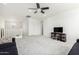 Comfortable loft with neutral carpet, tv console, a ceiling fan, and lots of space at 4727 S Watauga Dr, Gilbert, AZ 85297