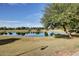 A peaceful view of the community pond with mature landscaping and serene water at 4727 S Watauga Dr, Gilbert, AZ 85297