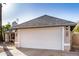 Close up of two car garage with mature landscaping and chimney at 4813 W Milky Way, Chandler, AZ 85226