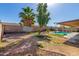 Large backyard showcasing a pool, patio, privacy fence, and potential for landscaping at 5025 N 85Th Dr, Glendale, AZ 85305