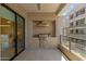 Outdoor kitchen and dining area on balcony featuring built-in barbeque grill, ample countertop space, and modern appliances at 5250 E Deer Valley Dr # 246, Phoenix, AZ 85054