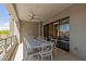 Spacious balcony with an outdoor dining area, comfortable seating, and panoramic views of the surrounding landscape at 5250 E Deer Valley Dr # 246, Phoenix, AZ 85054