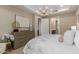 The bedroom features a dresser, chandelier, and doorway to the bathroom at 5250 E Deer Valley Dr # 246, Phoenix, AZ 85054