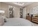 A well-lit bedroom offers a doorway to a walk-in closet and the kitchen at 5250 E Deer Valley Dr # 246, Phoenix, AZ 85054