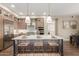 Modern kitchen features stainless steel appliances, a large island, and stylish pendant lighting at 5250 E Deer Valley Dr # 246, Phoenix, AZ 85054