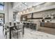Open floor plan, kitchen with a large center island with bar seating, and stainless steel appliances at 5250 E Deer Valley Dr # 246, Phoenix, AZ 85054