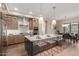 Open concept kitchen with a large island, modern appliances, and a view of the dining area at 5250 E Deer Valley Dr # 246, Phoenix, AZ 85054