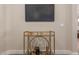 Stylish living room featuring a modern bar cart with glassware, complemented by a sleek, wall-mounted television at 5250 E Deer Valley Dr # 246, Phoenix, AZ 85054