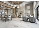 Bright lobby features stylish marble floors, seating area, and a modern fireplace with a wall-mounted TV at 5250 E Deer Valley Dr # 246, Phoenix, AZ 85054