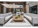 Stylish patio area featuring comfortable seating, a large umbrella, and a sleek coffee table at 5250 E Deer Valley Dr # 246, Phoenix, AZ 85054