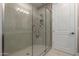 A luxurious walk-in shower features a glass enclosure and modern fixtures at 5250 E Deer Valley Dr # 246, Phoenix, AZ 85054