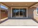 Covered back patio and sliding glass doors leading into the home at 5359 W Las Palmaritas Dr, Glendale, AZ 85302