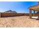 Large lot backyard featuring a covered patio and a block wall at 5359 W Las Palmaritas Dr, Glendale, AZ 85302