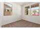 Neutral bedroom with three large windows, offering natural light and views at 5359 W Las Palmaritas Dr, Glendale, AZ 85302