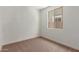 Bright bedroom with a large window, creating a comfortable and airy atmosphere at 5359 W Las Palmaritas Dr, Glendale, AZ 85302