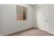 Bedroom with a large window and closet at 5359 W Las Palmaritas Dr, Glendale, AZ 85302