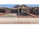 Inviting single-story home with a two-car garage, charming entry and desert landscape at 5359 W Las Palmaritas Dr, Glendale, AZ 85302