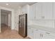 Elegant kitchen featuring white cabinets, stainless steel appliances, and sleek countertops, enhancing the cooking space at 5359 W Las Palmaritas Dr, Glendale, AZ 85302