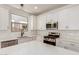 Bright kitchen featuring white cabinetry, stainless steel appliances, and a stylish subway tile backsplash at 5359 W Las Palmaritas Dr, Glendale, AZ 85302