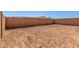 Large, empty backyard featuring a block fence and open space awaiting landscaping design at 5401 W Las Palmaritas Dr, Glendale, AZ 85302
