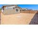 A spacious dirt backyard is surrounded by a block fence at 5401 W Las Palmaritas Dr, Glendale, AZ 85302