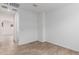 A bright bedroom with wood-look flooring and a neutral color scheme, creating a cozy space at 5401 W Las Palmaritas Dr, Glendale, AZ 85302