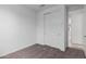 This bedroom offers sliding closet doors and access to hallway at 5401 W Las Palmaritas Dr, Glendale, AZ 85302