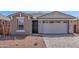 Beautiful single-story home featuring stone accents, a two-car garage, and low maintenance desert landscaping at 5401 W Las Palmaritas Dr, Glendale, AZ 85302