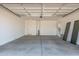Spacious two-car garage with a large concrete floor at 5401 W Las Palmaritas Dr, Glendale, AZ 85302