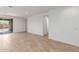 Open living room with tile flooring, recessed lighting, neutral paint, and sliding glass doors to the outside at 5401 W Las Palmaritas Dr, Glendale, AZ 85302