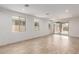 Spacious living room with tile floors, recessed lighting, and large windows for plenty of natural light at 5401 W Las Palmaritas Dr, Glendale, AZ 85302