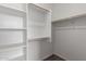 Organize your wardrobe in this walk-in closet with sturdy shelving and wood rods at 5401 W Las Palmaritas Dr, Glendale, AZ 85302