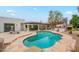 Spacious backyard with a pool, patio, and lush landscaping at 5650 E Presidio Rd, Scottsdale, AZ 85254