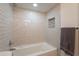 Bright bathroom features a tiled tub, shower, and modern design at 5650 E Presidio Rd, Scottsdale, AZ 85254