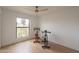Bright bedroom with wood floors, ceiling fan, and bright window view at 5650 E Presidio Rd, Scottsdale, AZ 85254