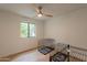 Bright bedroom with wood floors, ceiling fan, and bright window view at 5650 E Presidio Rd, Scottsdale, AZ 85254