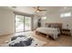 Bright bedroom with hardwood floors, a sliding glass door, and access to outdoor space at 5650 E Presidio Rd, Scottsdale, AZ 85254