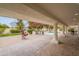 Large covered patio overlooking the backyard pool and grill area, perfect for outdoor dining and entertaining at 5650 E Presidio Rd, Scottsdale, AZ 85254