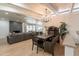 Open concept dining room featuring stylish seating and a view of the outdoor pool area at 5650 E Presidio Rd, Scottsdale, AZ 85254