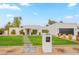 Stunning modern home with a well-manicured lawn, a stylish mailbox and a three-car garage at 5650 E Presidio Rd, Scottsdale, AZ 85254