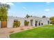 Modern home with well-manicured front yard, xeriscaping, and courtyard entrance at 5650 E Presidio Rd, Scottsdale, AZ 85254