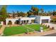 Beautiful, modern single-Gathering home with a well-manicured lawn and appealing desert landscaping at 5650 E Presidio Rd, Scottsdale, AZ 85254