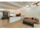 Spacious living room with beamed ceilings, hardwood floors, and an open layout at 5650 E Presidio Rd, Scottsdale, AZ 85254