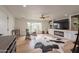 Spacious living area features wood floors, built-in shelving, fireplace, and a large window for natural light at 5650 E Presidio Rd, Scottsdale, AZ 85254